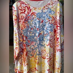 A beautiful 3/4 length sleeve long shirt with rhinestones on the front!